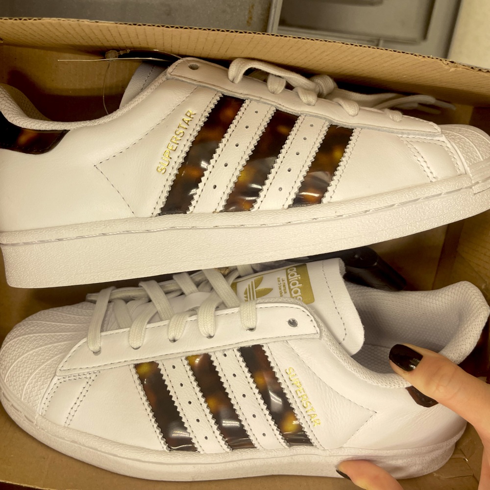 Adidas superstar with tortoise stripes